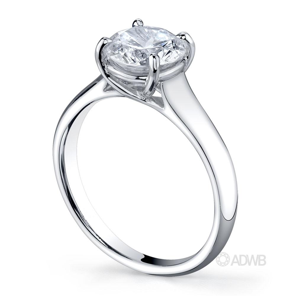 Cross claw round brilliant cut diamond solitaire ring with wide band