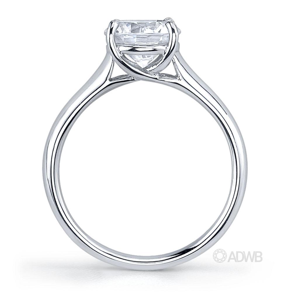 Cross claw round brilliant cut diamond solitaire ring with wide band