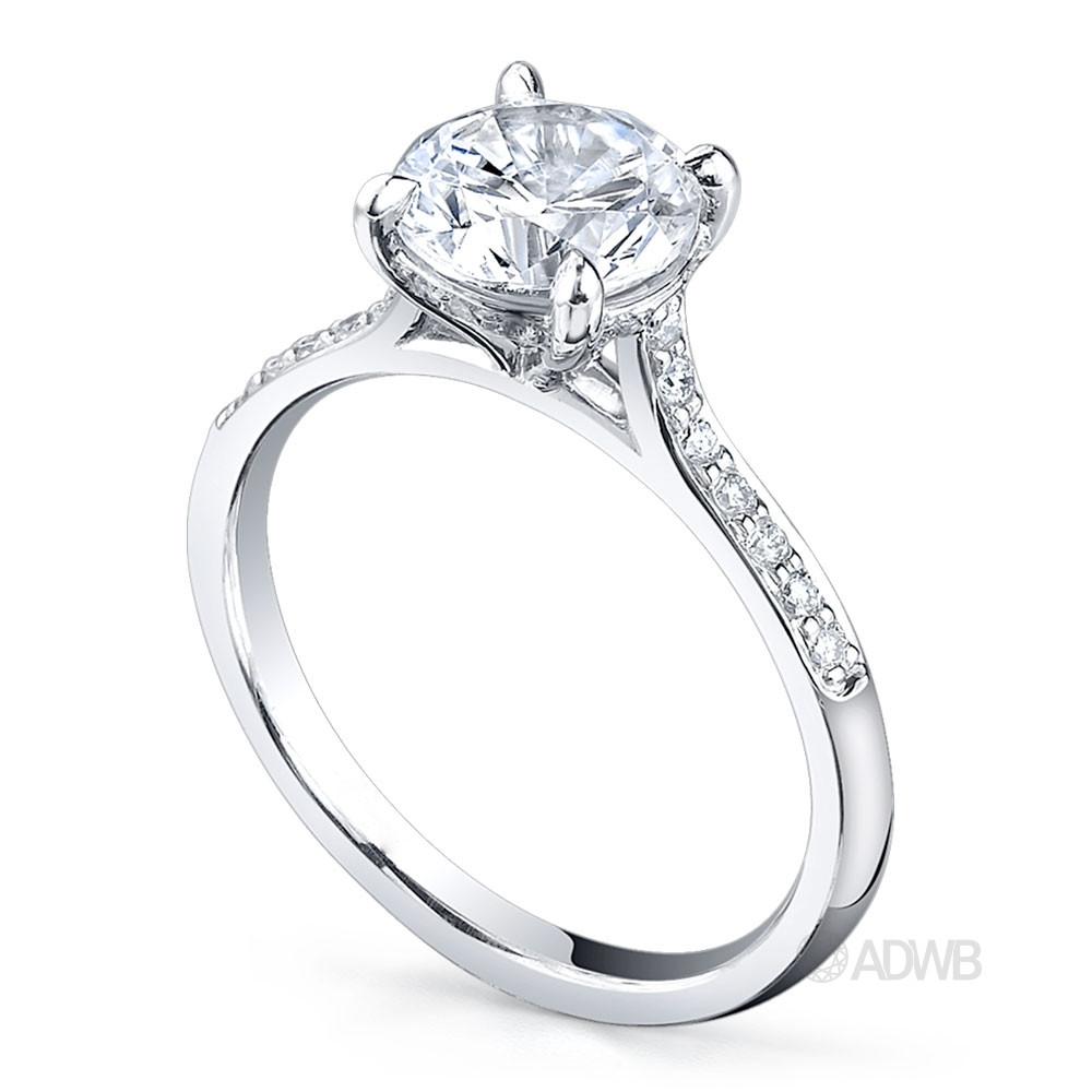 Caroline 4 claw round brilliant cut diamond solitaire ring with grain set diamonds in the band