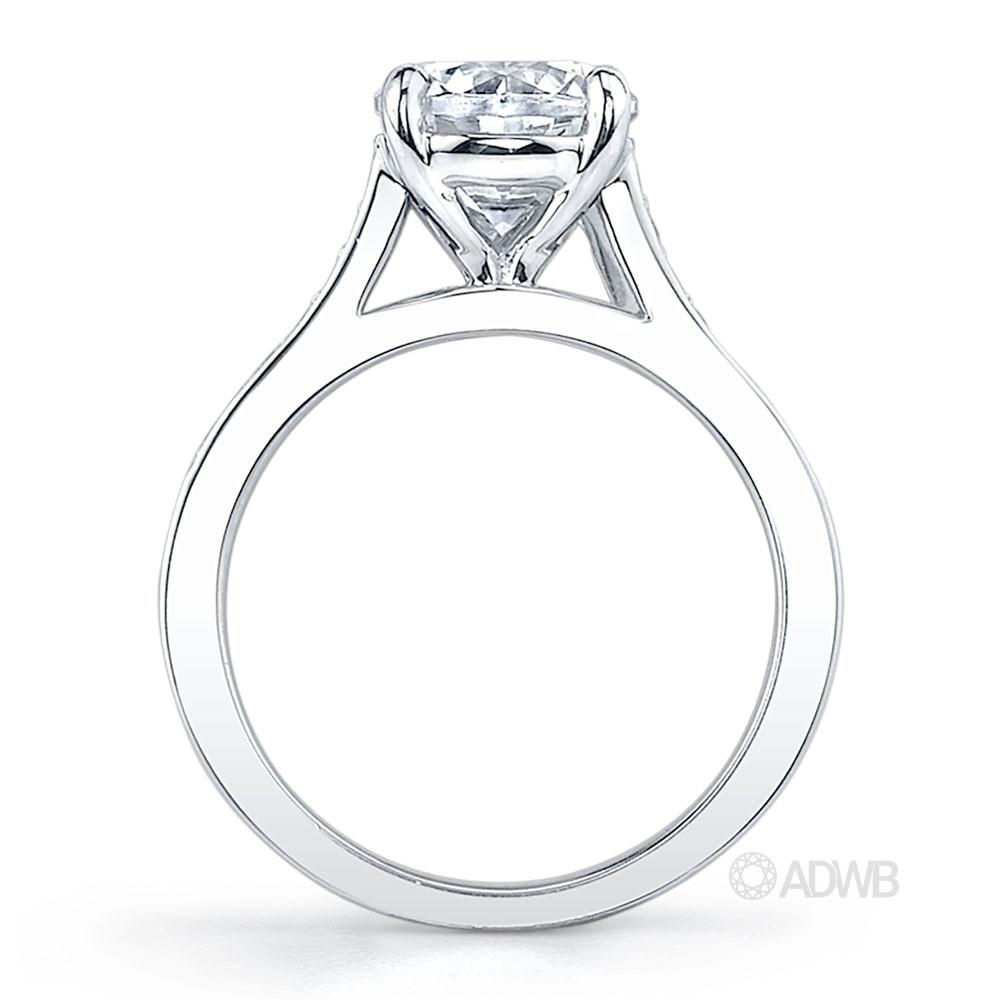 Traditional round brilliant cut diamond ring with grain set diamonds in the band