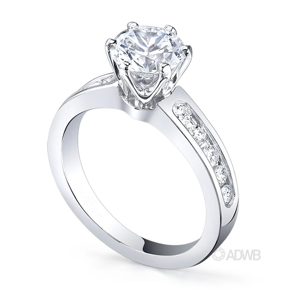 Monica classic 6 claw round brilliant cut diamond ring with channel set band