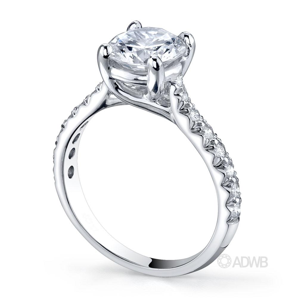 Star 4 claw round brilliant cut diamond solitaire ring with micro pave set band