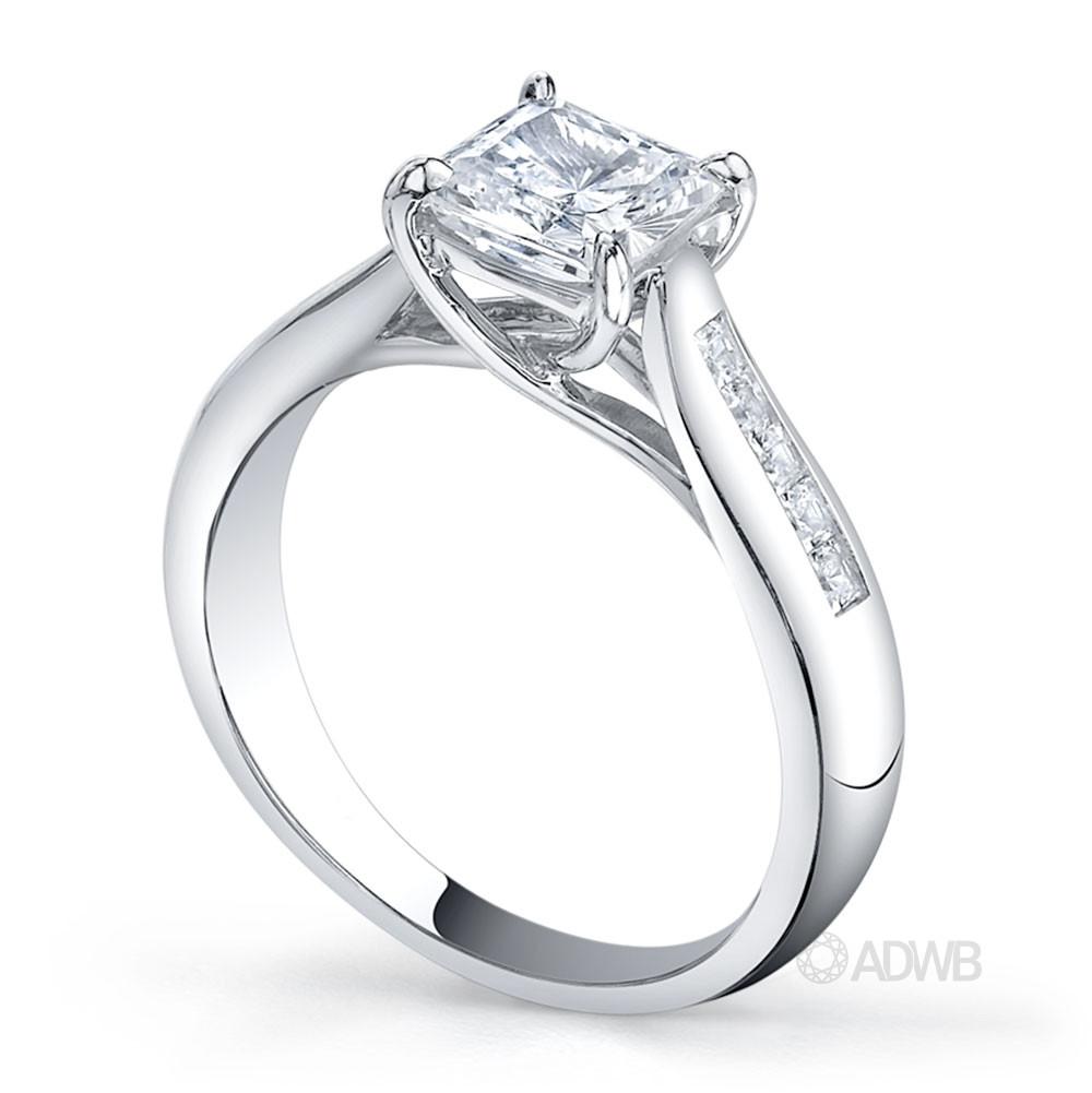 Cross prong princess cut ring with channel set princess cut side diamonds tapered out band