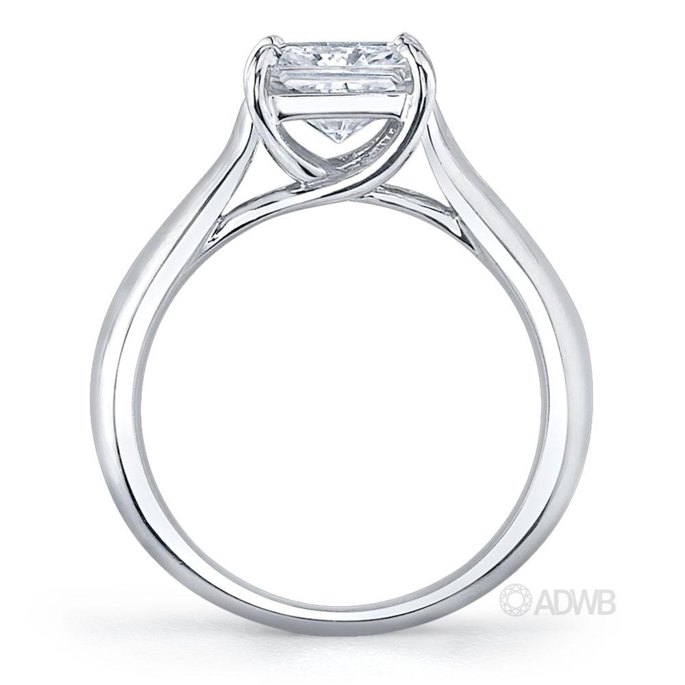Cross prong princess cut ring with channel set baguette diamonds