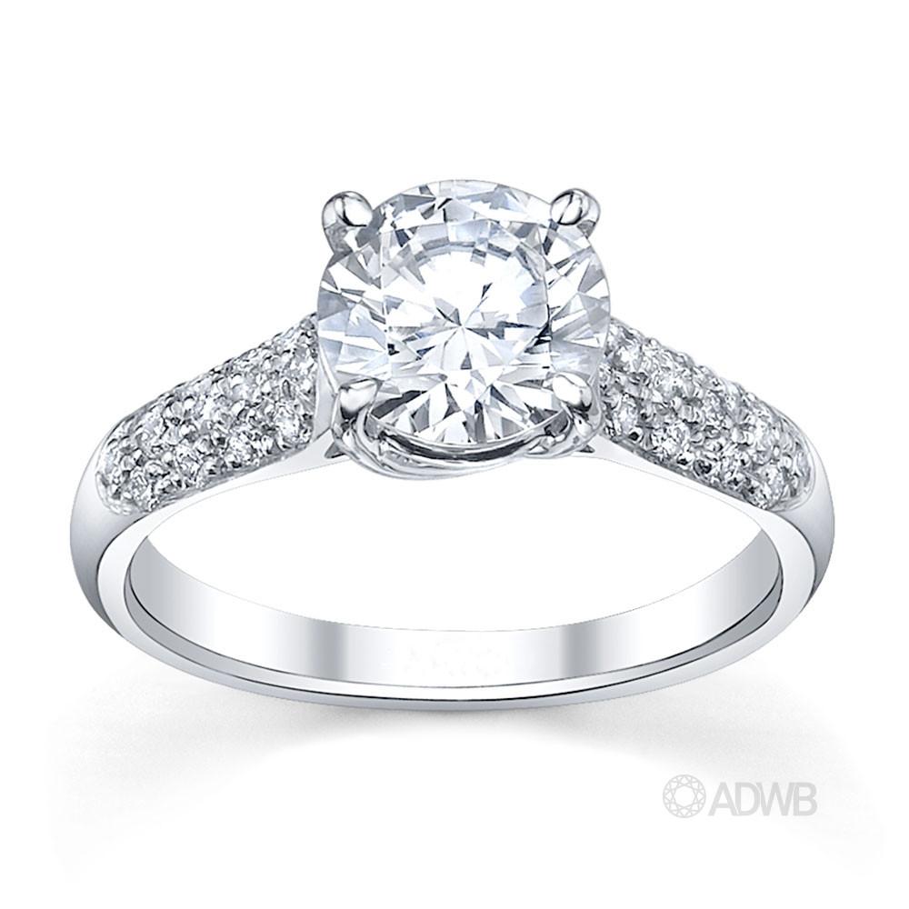 Star 4 claw round brilliant cut diamond solitaire ring with pave set band