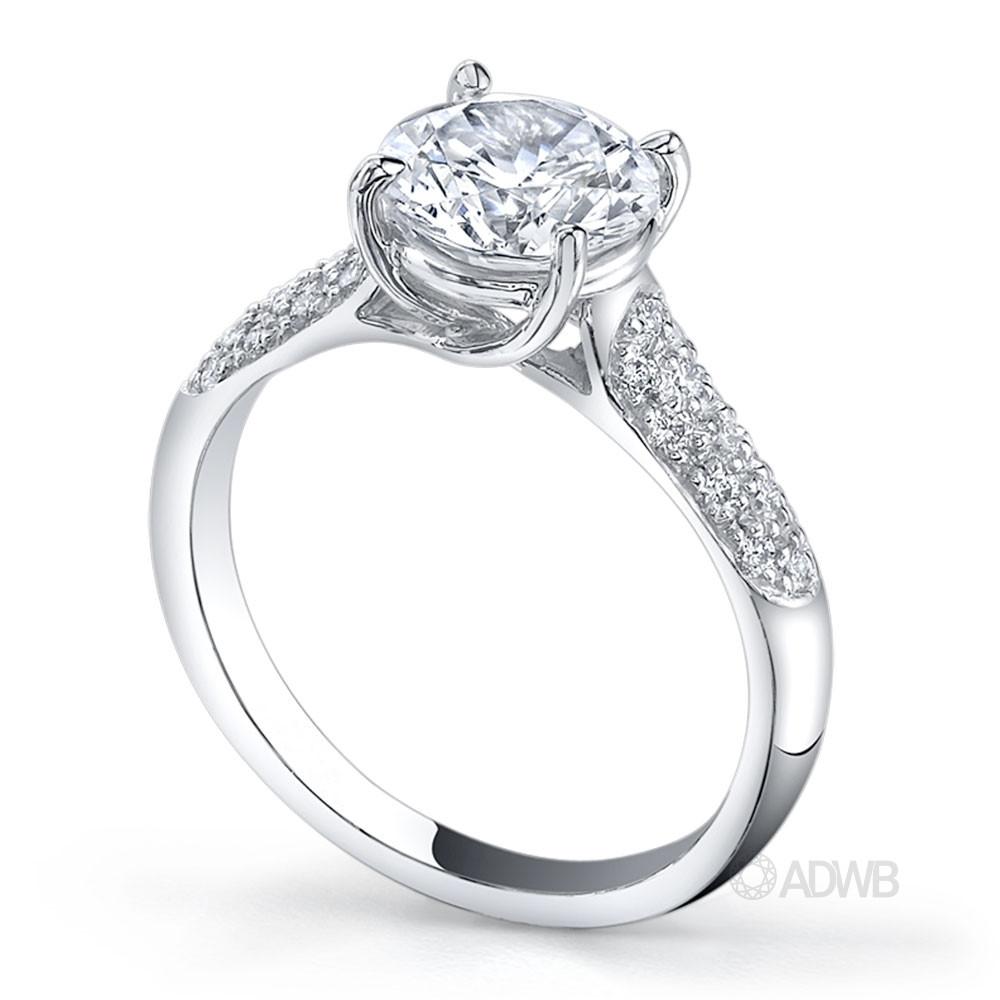 Star 4 claw round brilliant cut diamond solitaire ring with pave set band