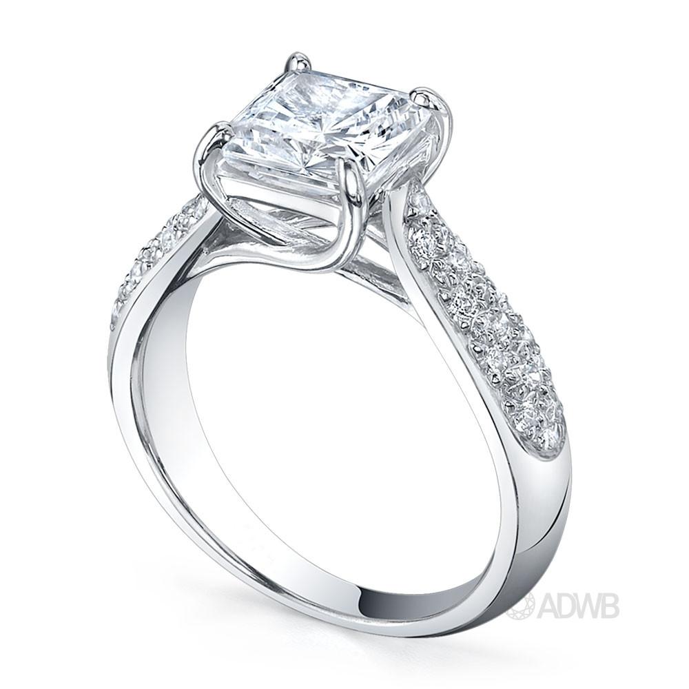 Cross claw solitaire princess cut diamond ring with tapered round brilliant cut diamond pave set band