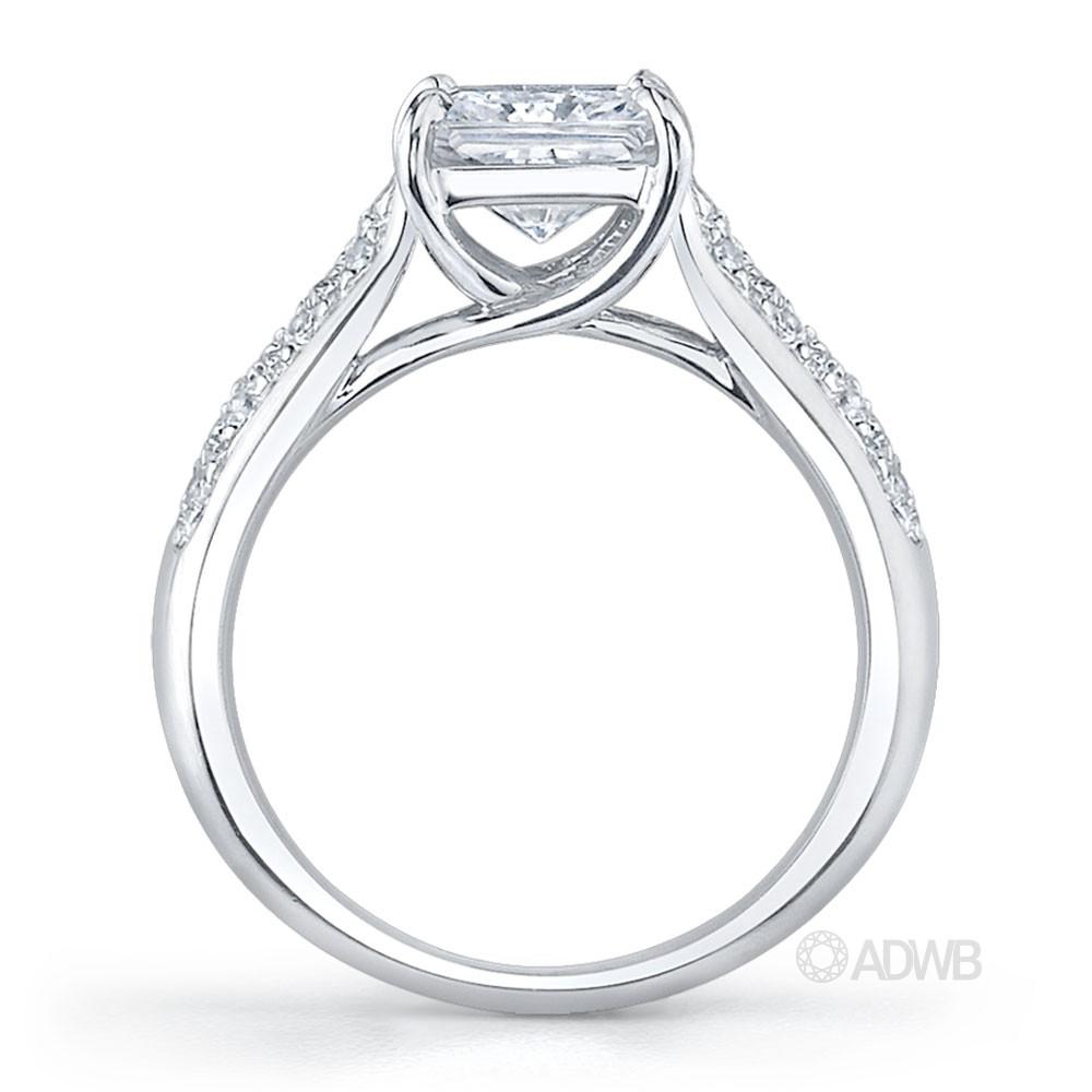 Cross claw solitaire princess cut diamond ring with tapered round brilliant cut diamond pave set band