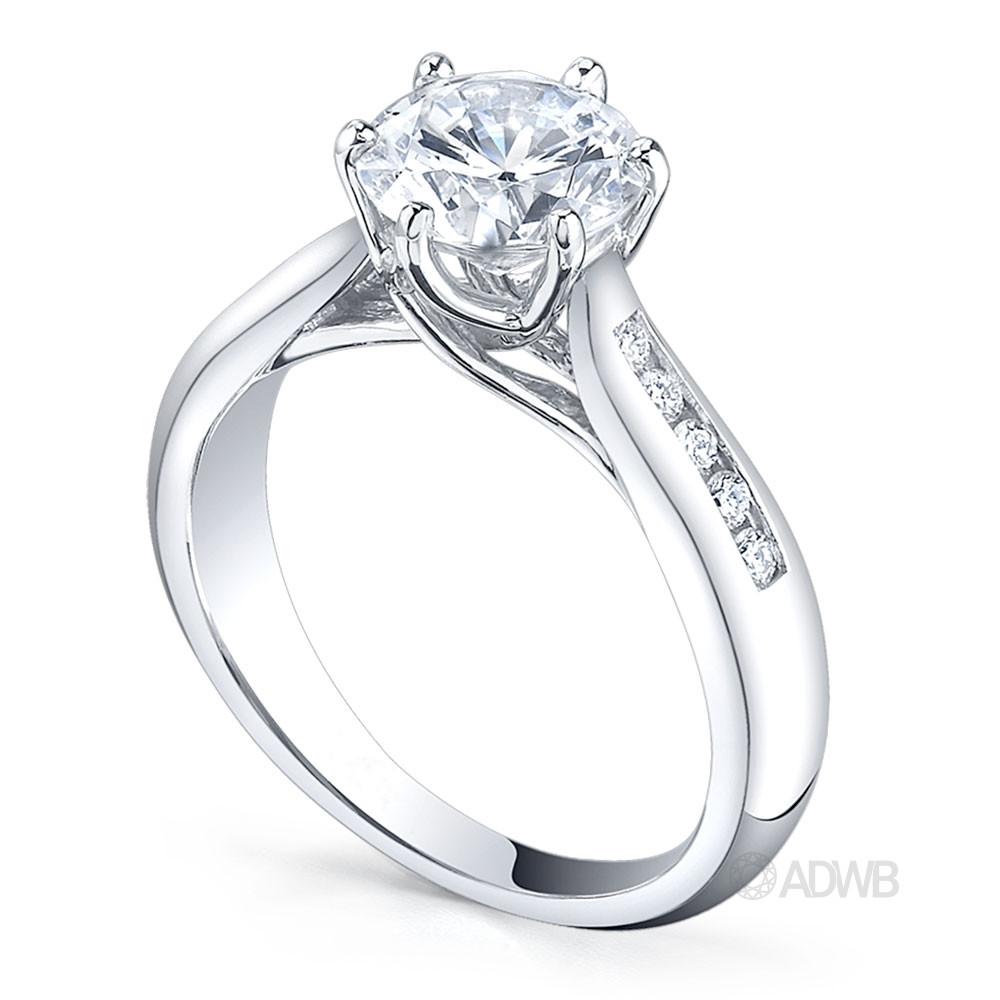 Royal crown round brilliant cut diamond ring with tapered channel set band