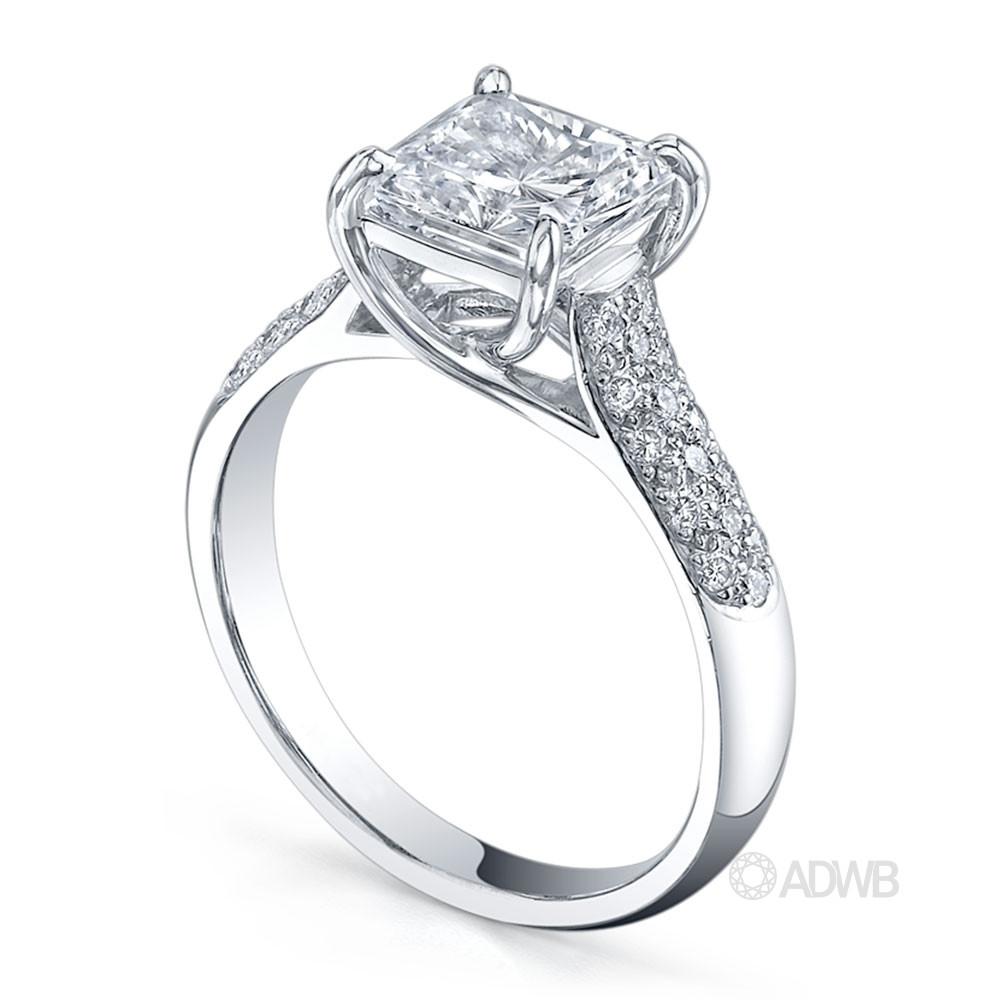 Cross claw princess cut ring with round brilliant cut diamonds pave set band