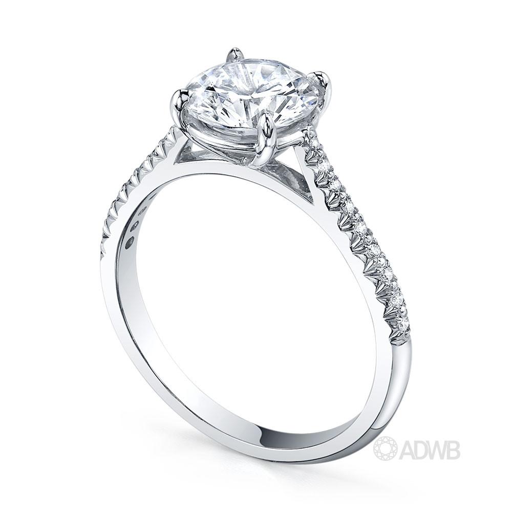 Traditional round brilliant cut diamond ring with micro pave set diamond band