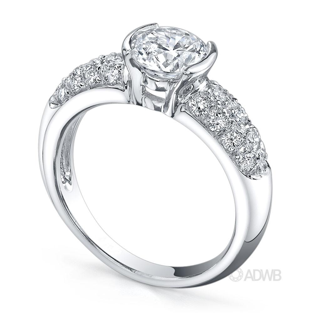 Half bezel set round brilliant cut diamond solitaire ring with pave set band