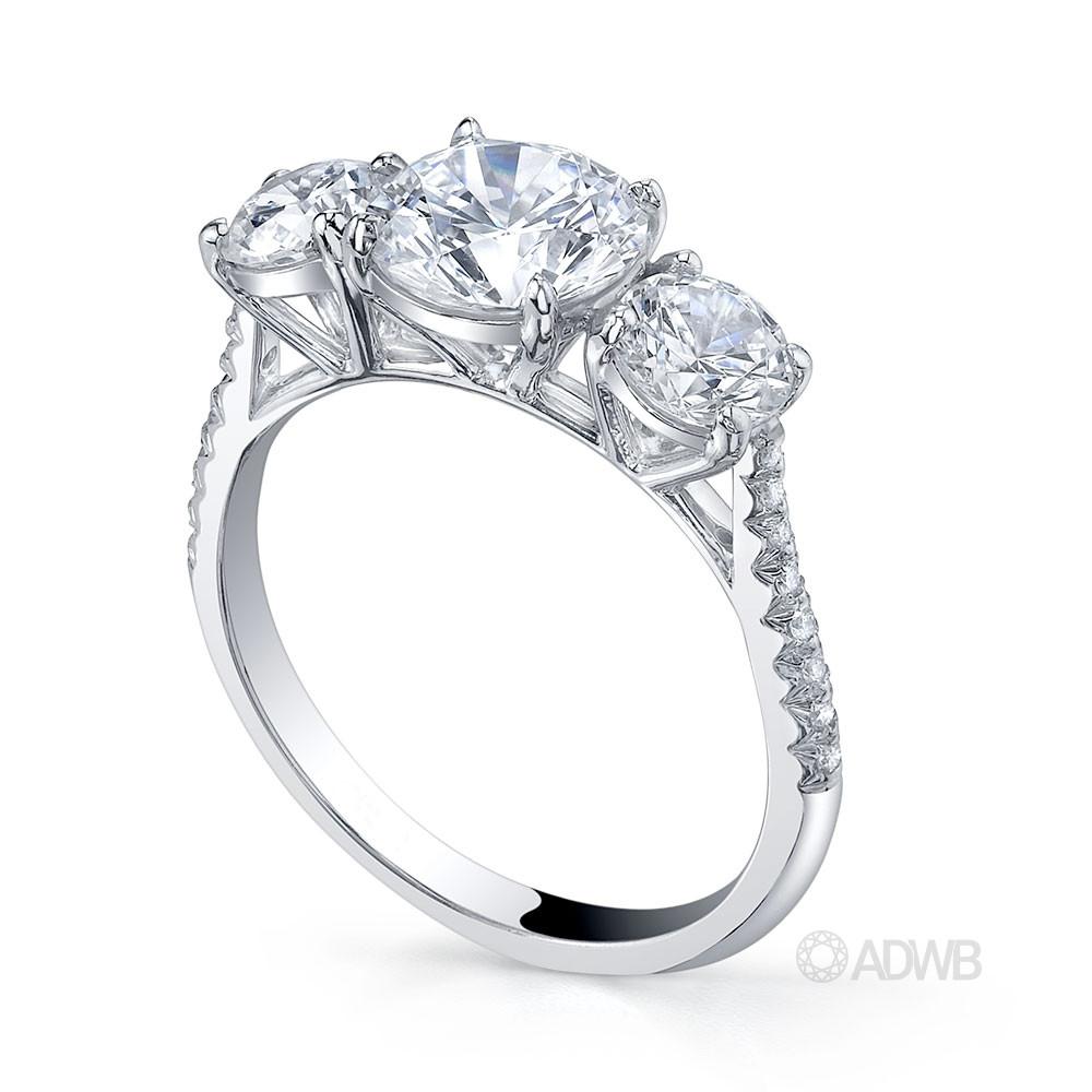 Classic 3 stone round brilliant cut diamond ring with micro pave set diamond band