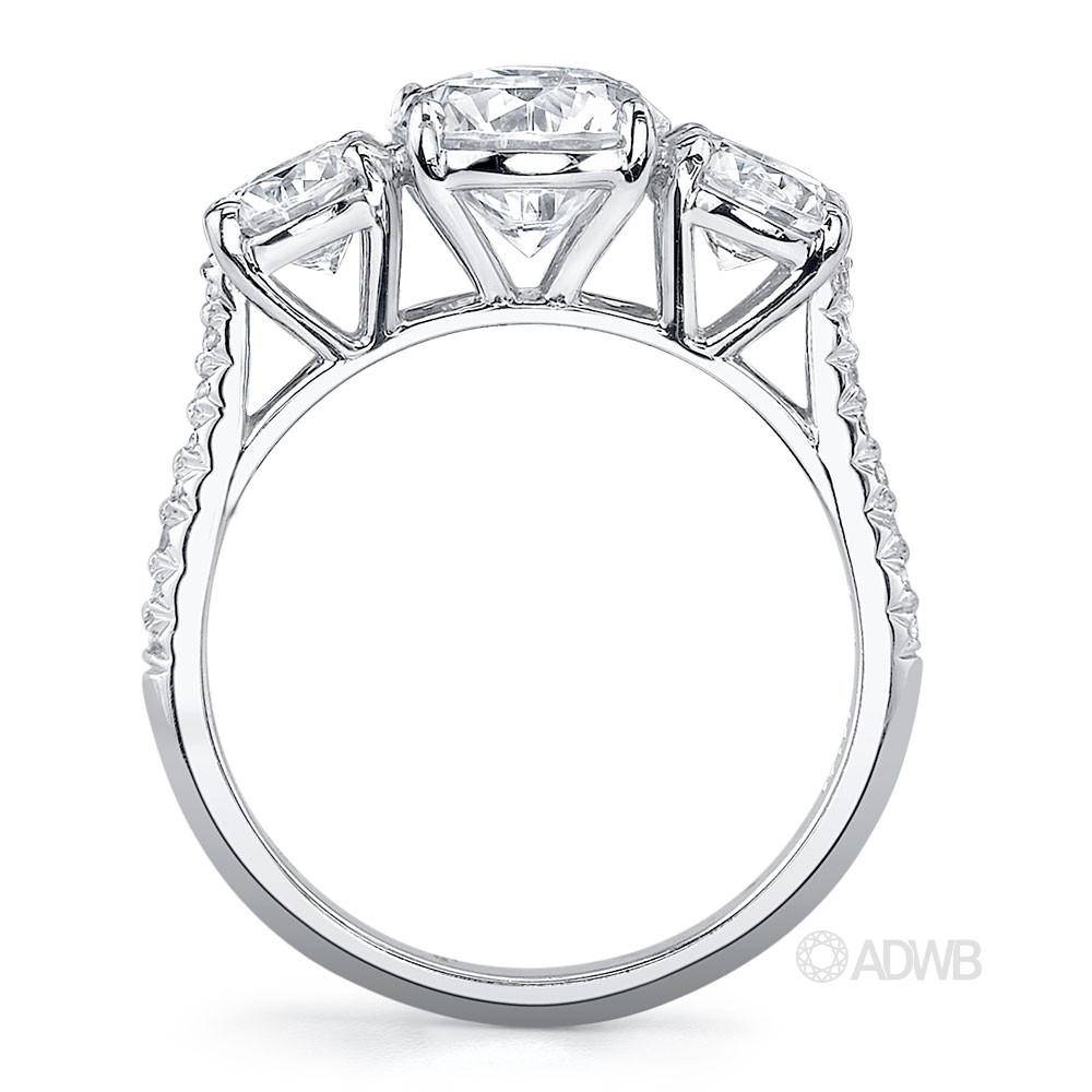 Classic 3 stone round brilliant cut diamond ring with micro pave set diamond band