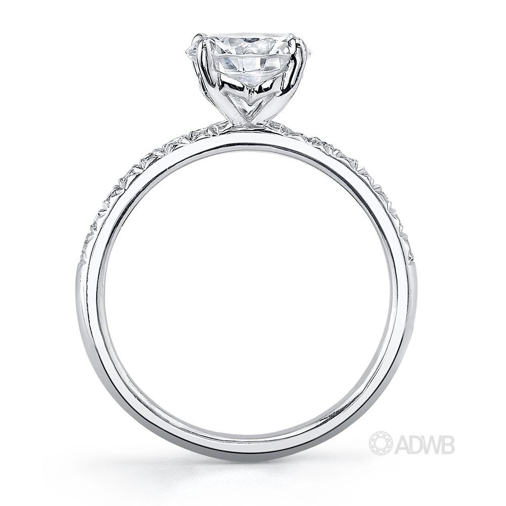 Zara round brilliant cut diamond solitaire ring with pave set diamond band