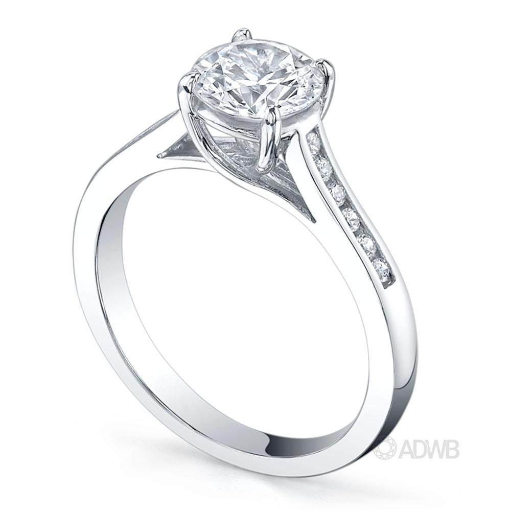 Monaco 4 claw diamond solitaire ring with channel set diamond band