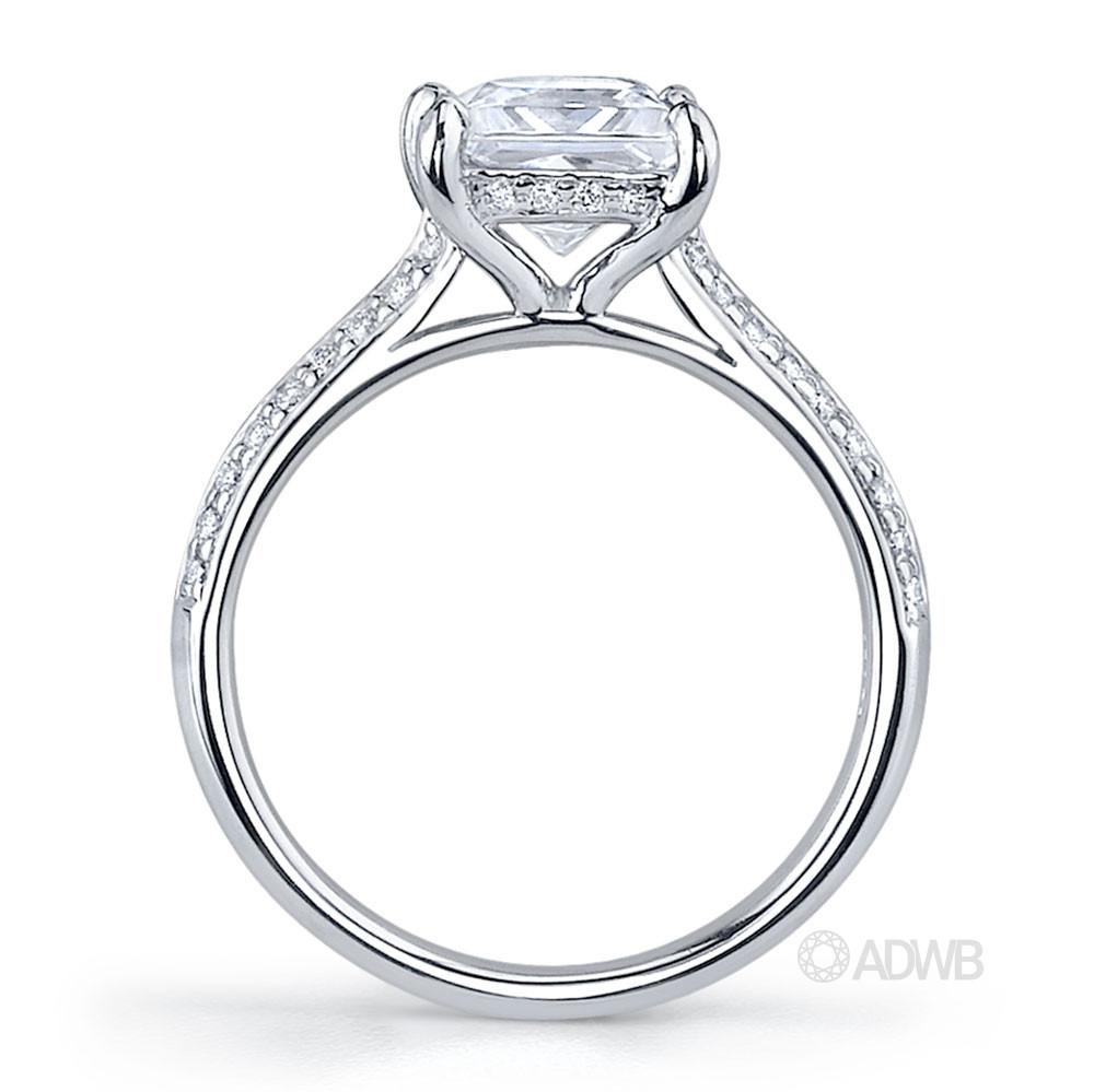 Regal princess cut diamond ring with grain set diamond knife edge band