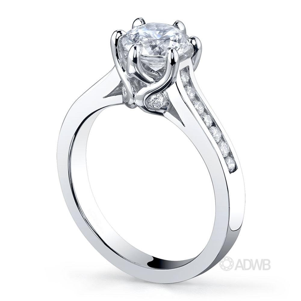 Elegant 6 claw round brilliant cut diamond solitaire ring with channel set band