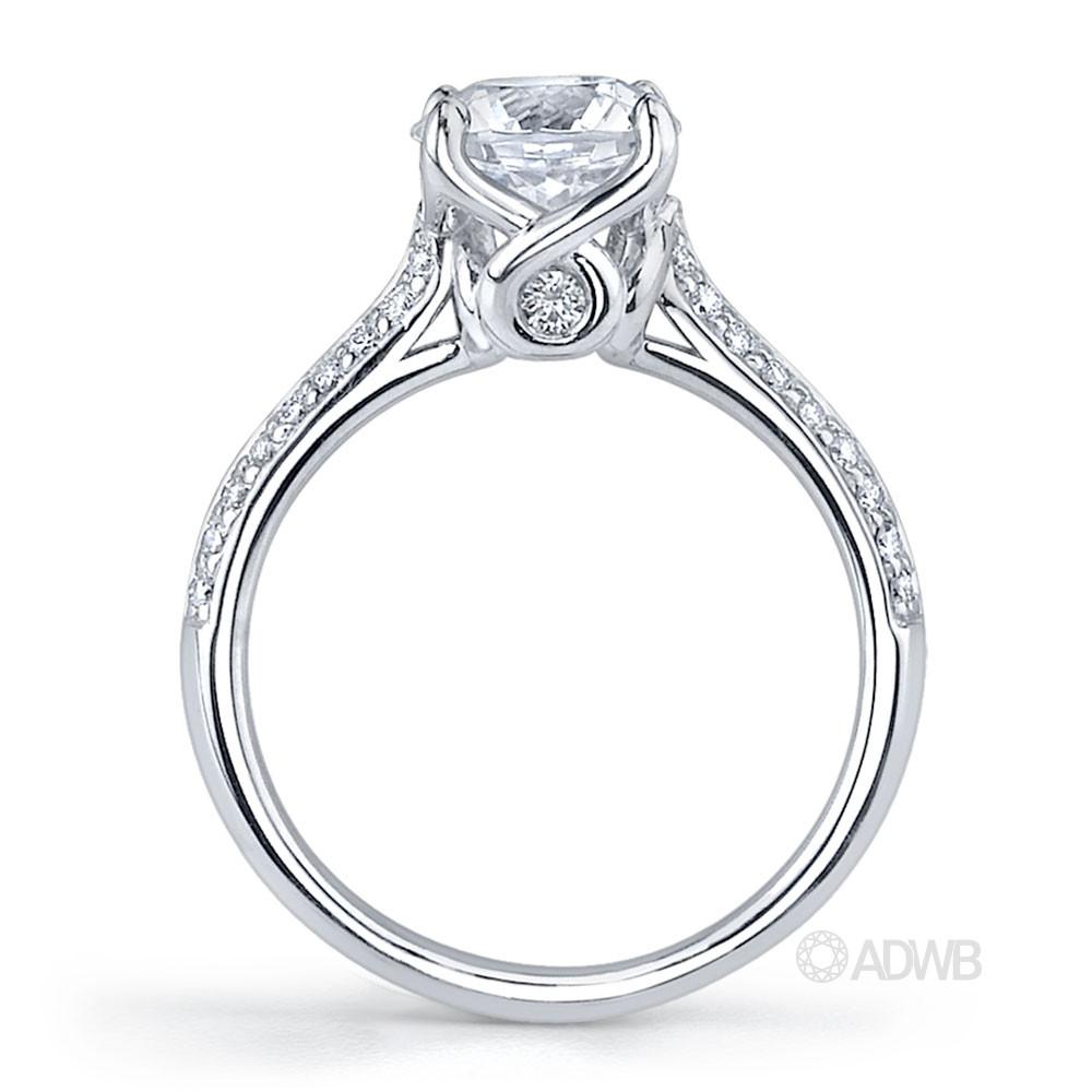 Elegant 4 claw round brilliant cut diamond solitaire ring with knife edge grain set diamond band