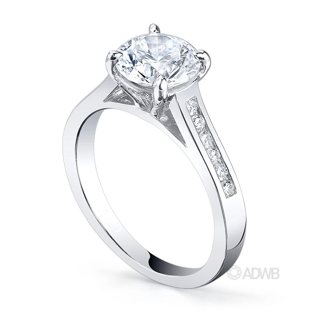 Caroline 4 claw round brilliant cut diamond solitaire ring with round brilliant cut channel set diamond