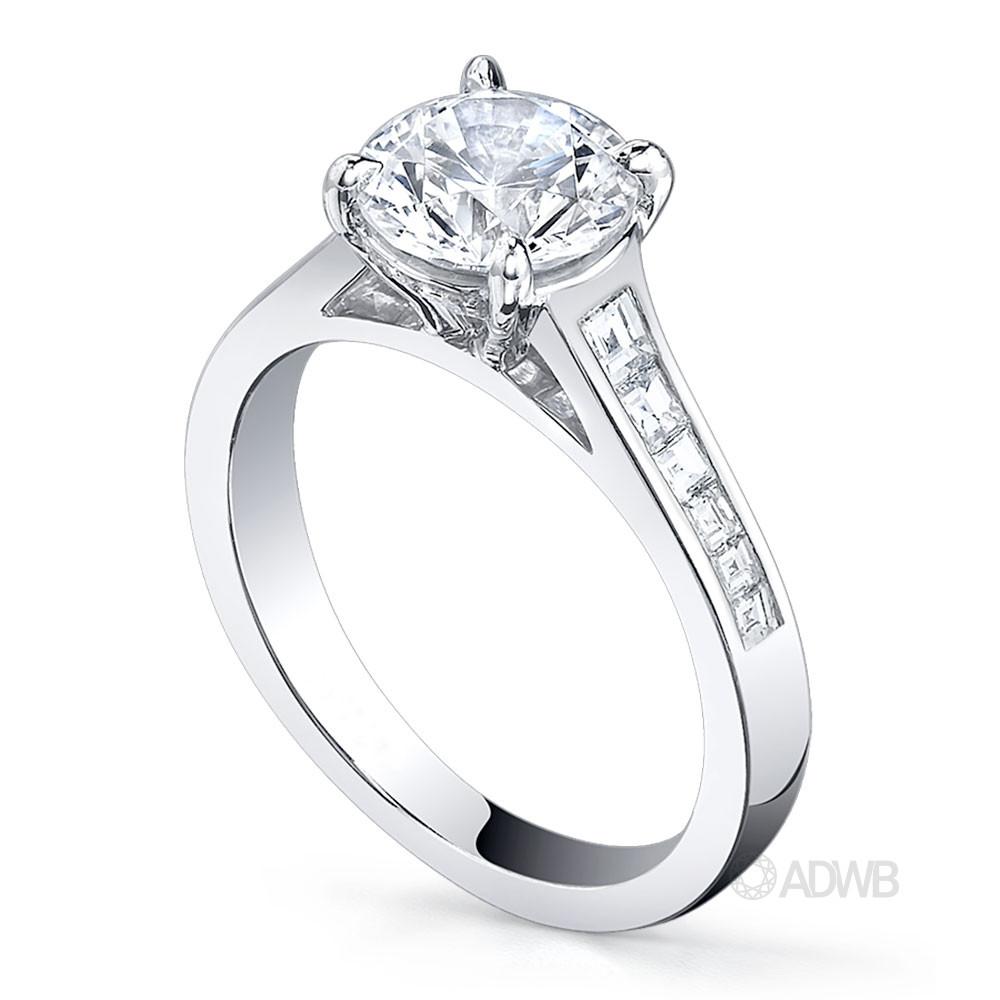 Caroline 4 claw round brilliant cut diamond solitaire ring with princess cut channel set diamond