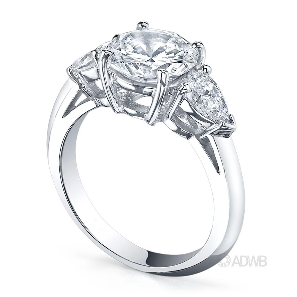 Round brilliant and pear cut diamond 3 stone ring