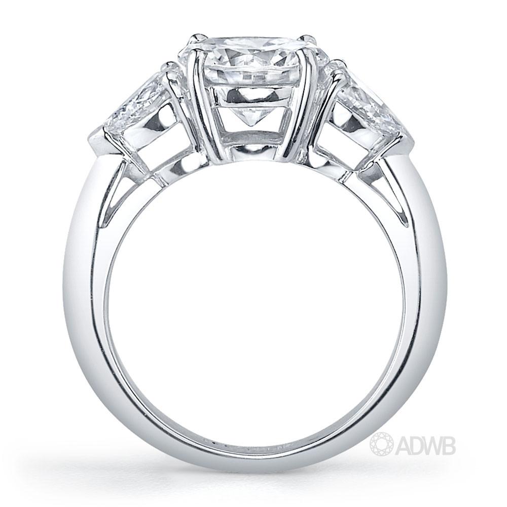 Round brilliant and pear cut diamond 3 stone ring