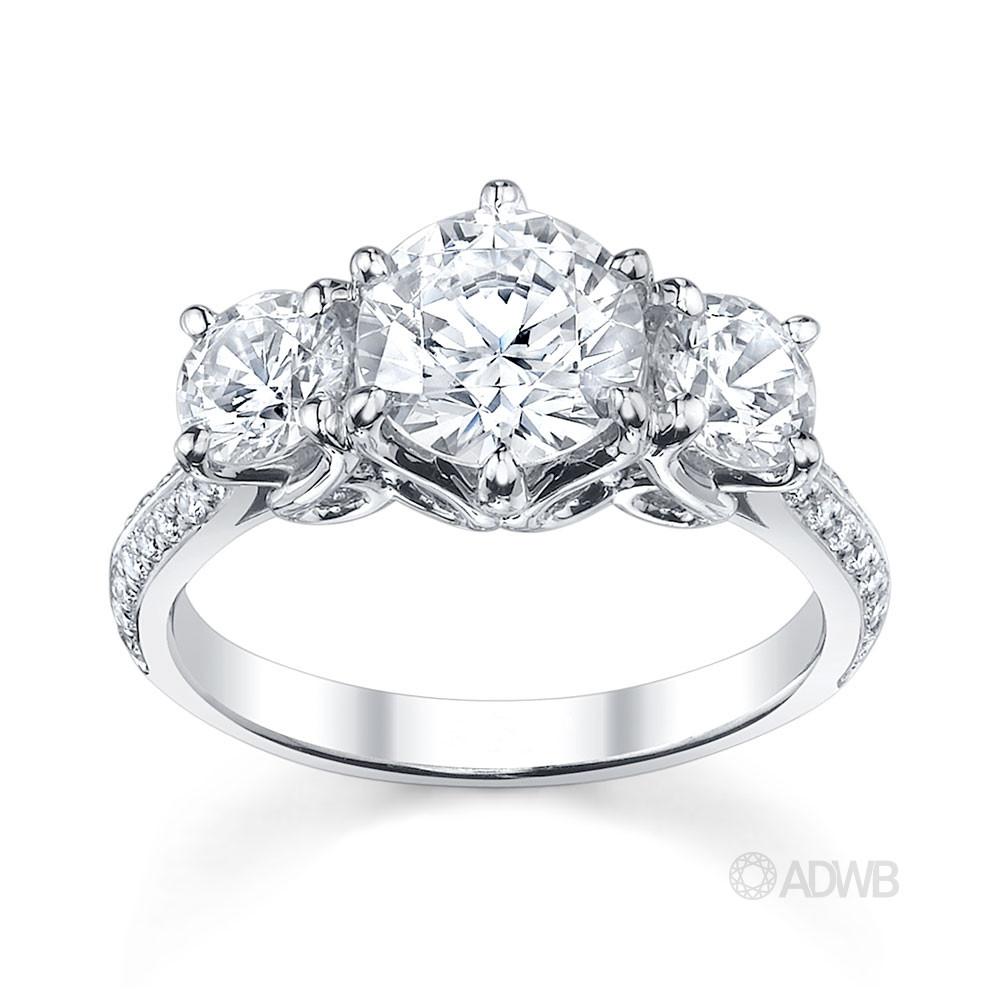 Australian Diamond Broker - Elegant 3 stone round brilliant cut diamond ring with knife edge grain set diamond band