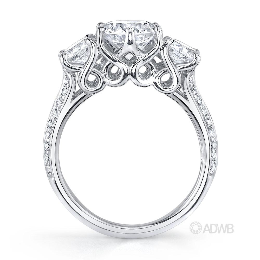 Elegant 3 stone round brilliant cut diamond ring with knife edge grain set diamond band