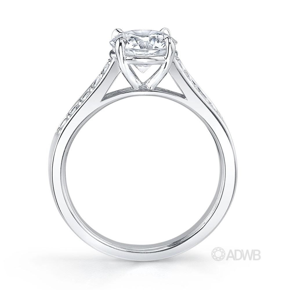 Traditional round brilliant cut diamond ring with bead set diamond band