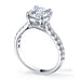 Star 4 claw round brilliant cut diamond solitaire ring with micro pave set band