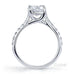 Star 4 claw round brilliant cut diamond solitaire ring with micro pave set band