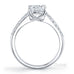Surprise round brilliant cut diamond ring with knife edge diamond band