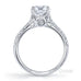 Elegant 4 claw round brilliant cut diamond solitaire ring with knife edge grain set diamond band